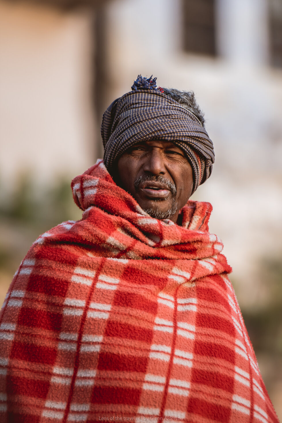 A portrait of a man in a red shawl, Varanasi, India — Glenn Alderson