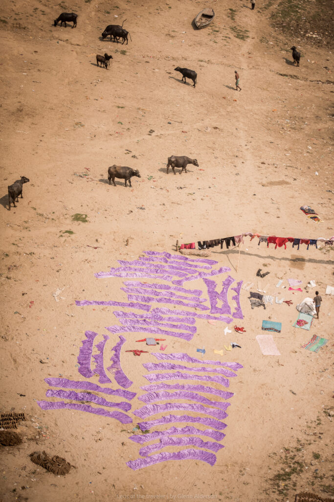 Clothes laid out on the riverbank, Varanasi, India — Glenn Alderson