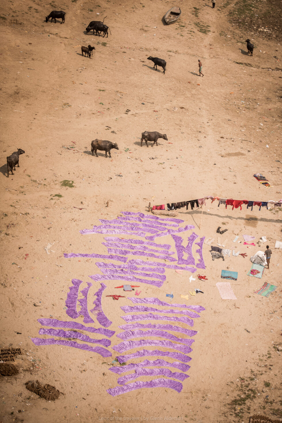 Clothes laid out on the riverbank, Varanasi, India — Glenn Alderson