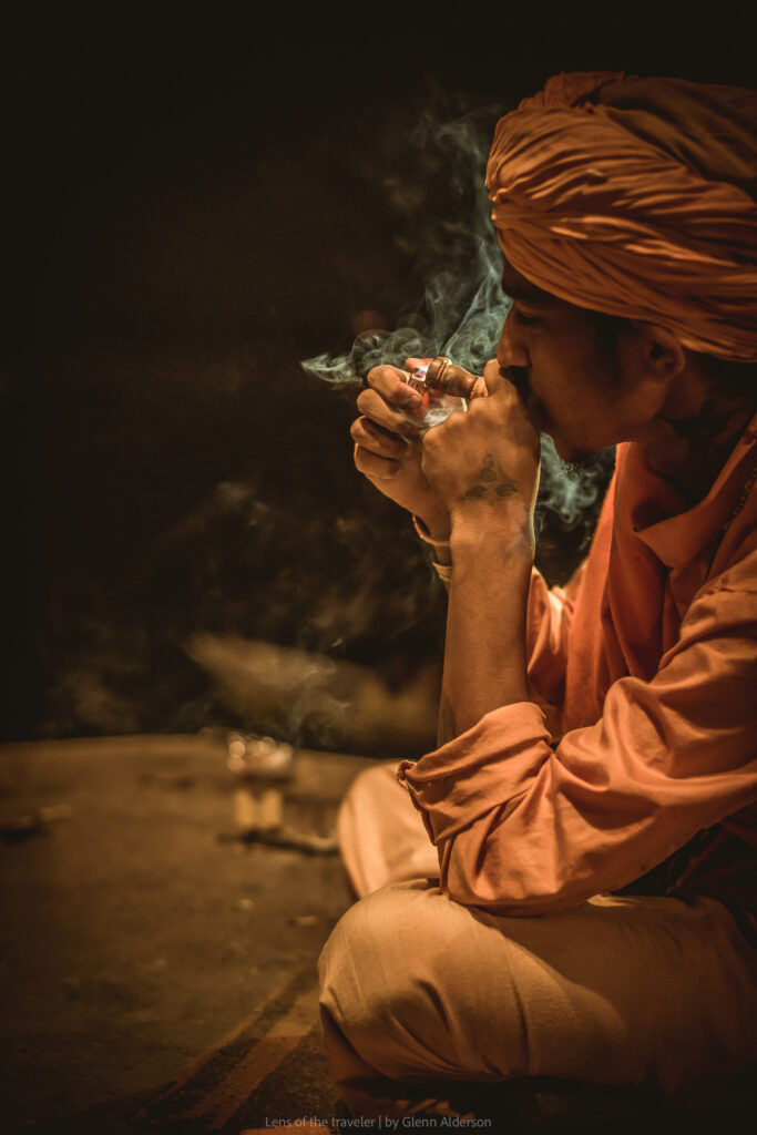A seated figure with hands held together, Varanasi, India — Glenn Alderson