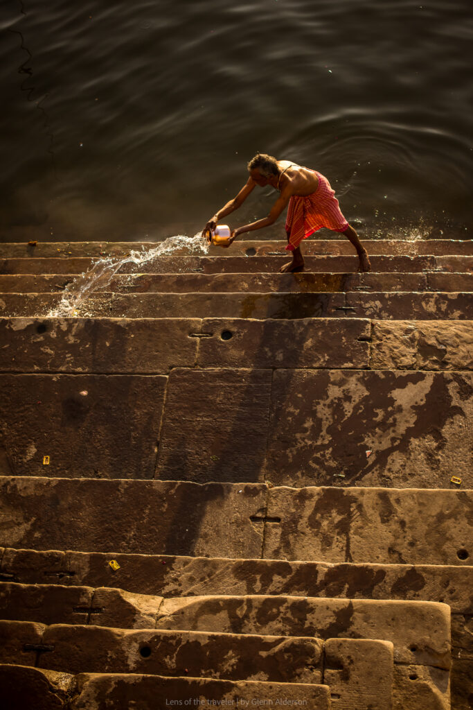 Water being poured across stone steps, Varanasi, India — Glenn Alderson