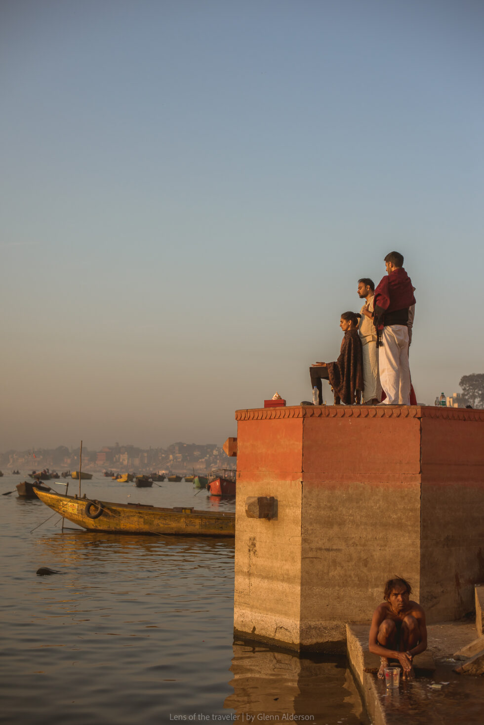 People standing above the river, Varanasi, India — Glenn Alderson