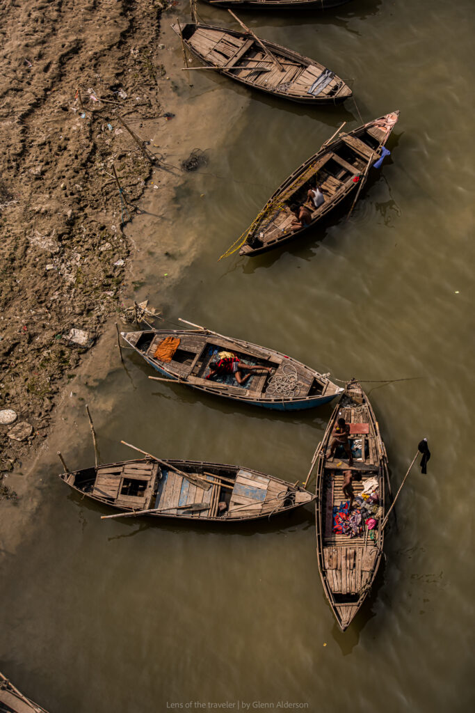 Wooden boats beside the riverbank, Varanasi, India — Glenn Alderson