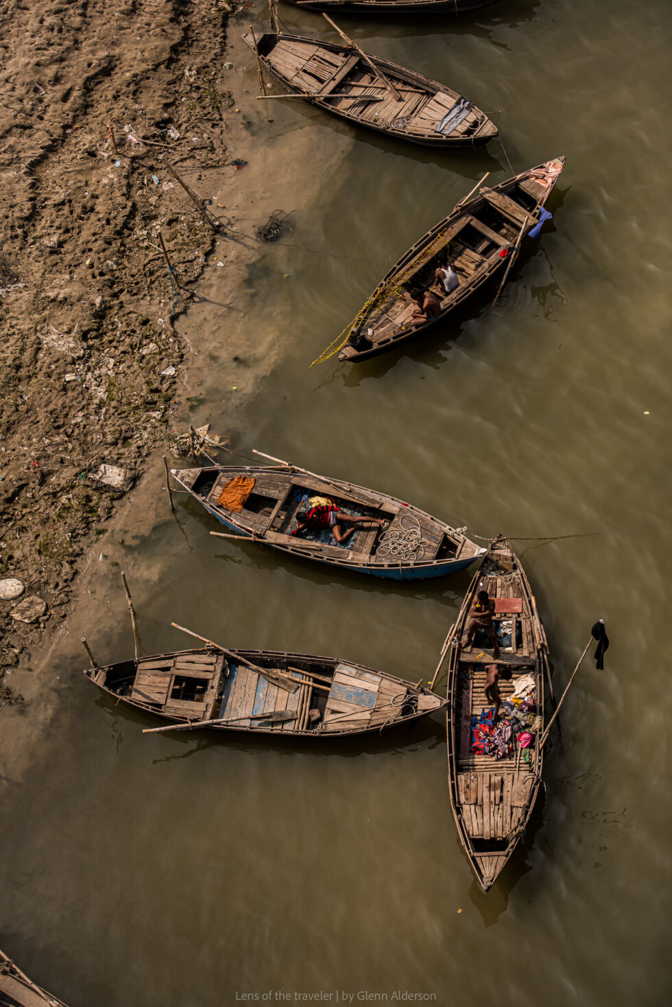 Wooden boats beside the riverbank, Varanasi, India — Glenn Alderson