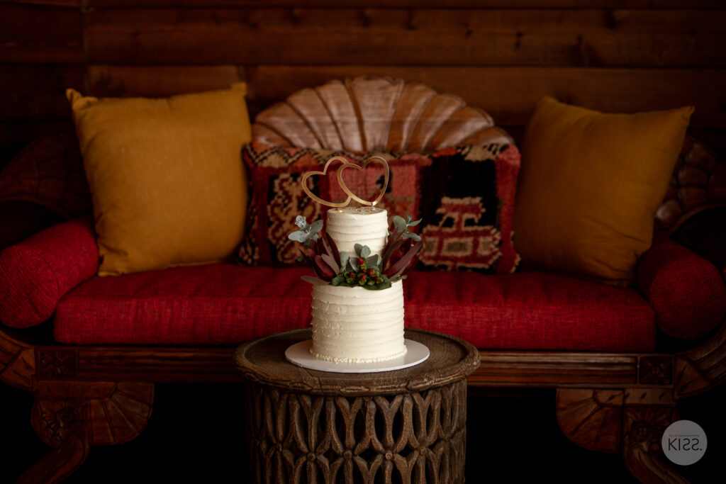A bouquet and wedding details on a table inside the cottage